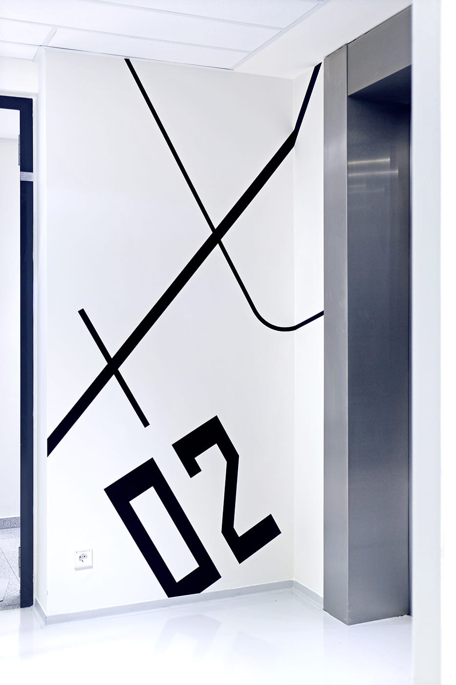Elevator lobby wall graphics and level identification sign
